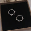 925 Sterling Silver Dot Hoops displayed in a jewellery box.