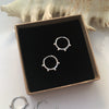 925 Sterling Silver Dot Hoops displayed in a jewellery box.