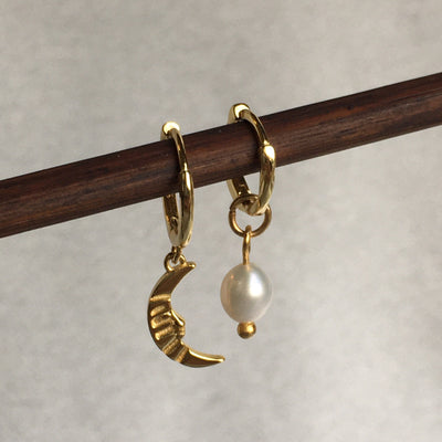 Vivid Moon earrings combined with a Pearl Drop earring