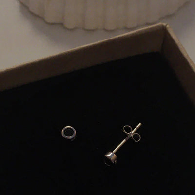Black Zirconia Studs in 925 Sterling Silver displayed in a jewellery box